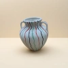White double-ear ceramic sealed jar with red, black and green wavy patterns, ceramic glass set Application Scenario